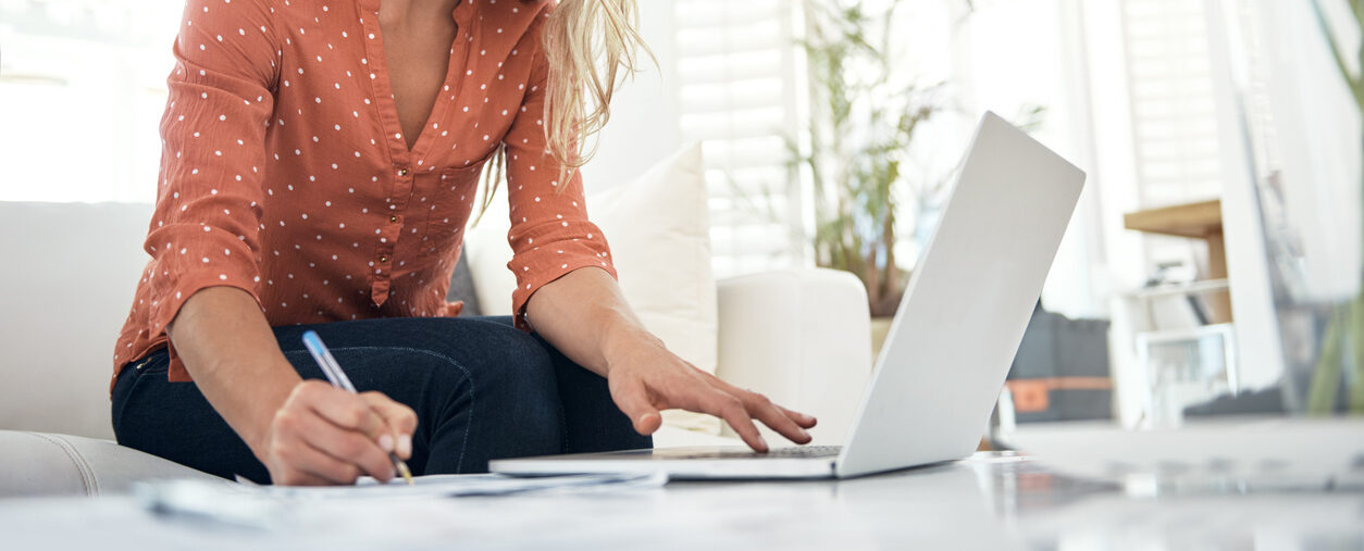 Woman on computer learning how to develop a blog content strategy