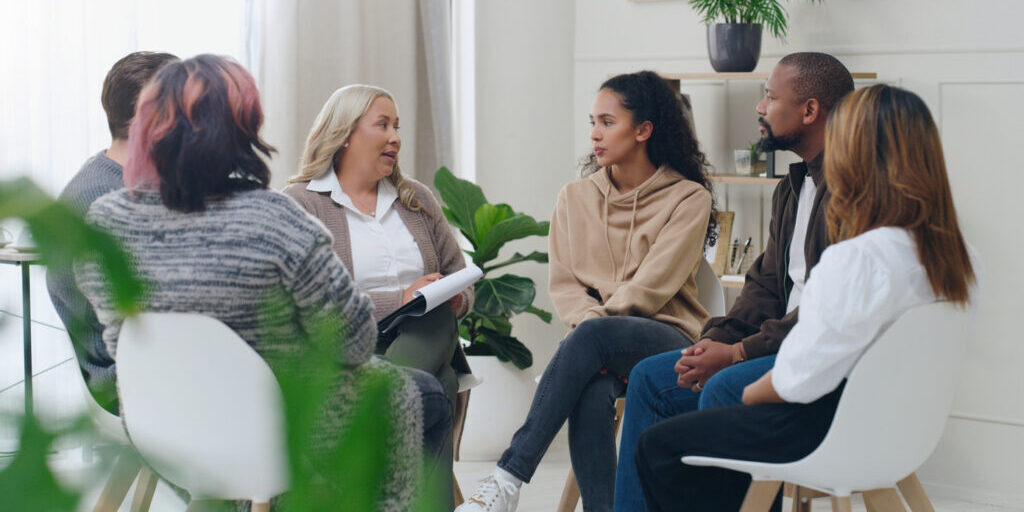 group therapy session after treatment center explored digital marketing for rehab and addiction treatment centers